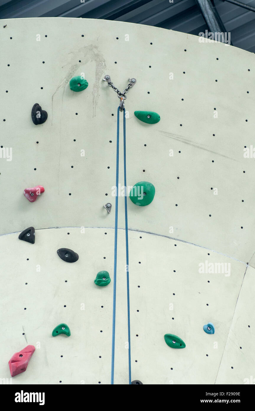 Safety equipment at an artificial rock climbing wall Stock Photo