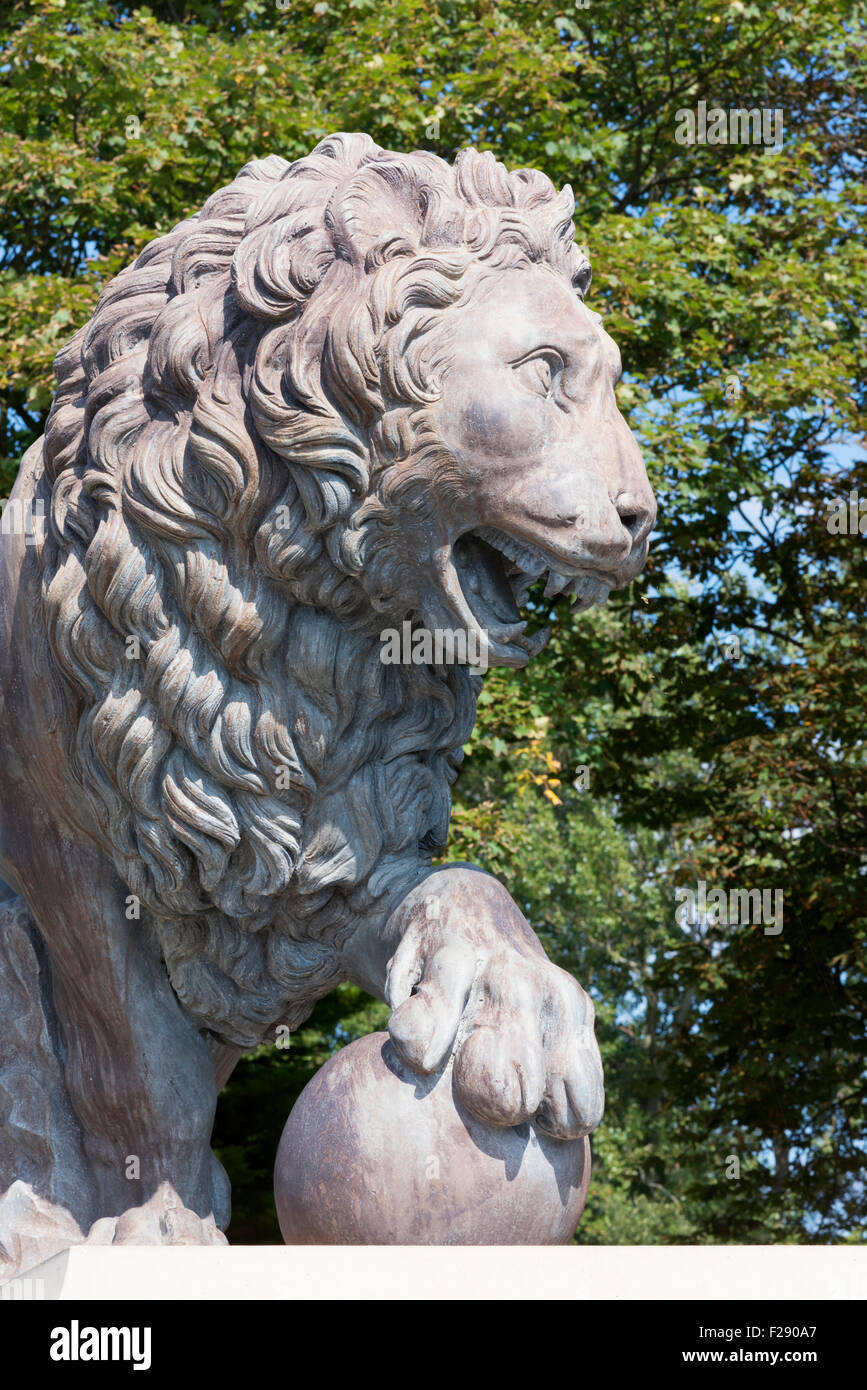 Statue of a roaring male lion on a plinth in Stanley Park, Blackpool, Lancashire Stock Photo