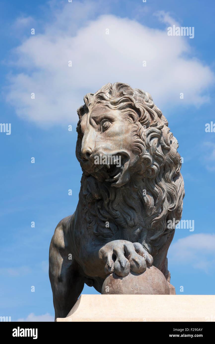 Statue of a roaring male lion on a plinth in Stanley Park, Blackpool, Lancashire Stock Photo