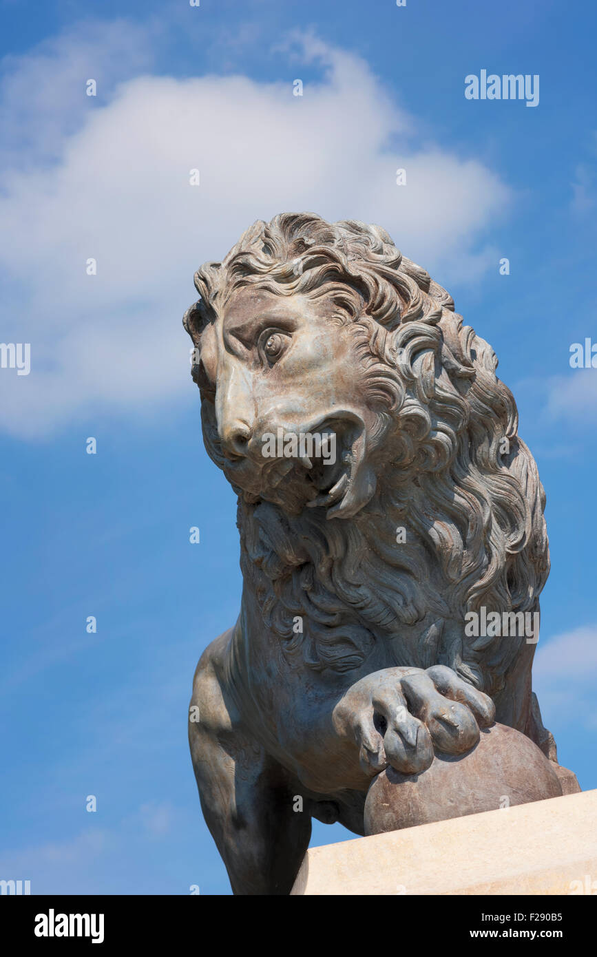 Statue of a roaring male lion on a plinth in Stanley Park, Blackpool, Lancashire Stock Photo