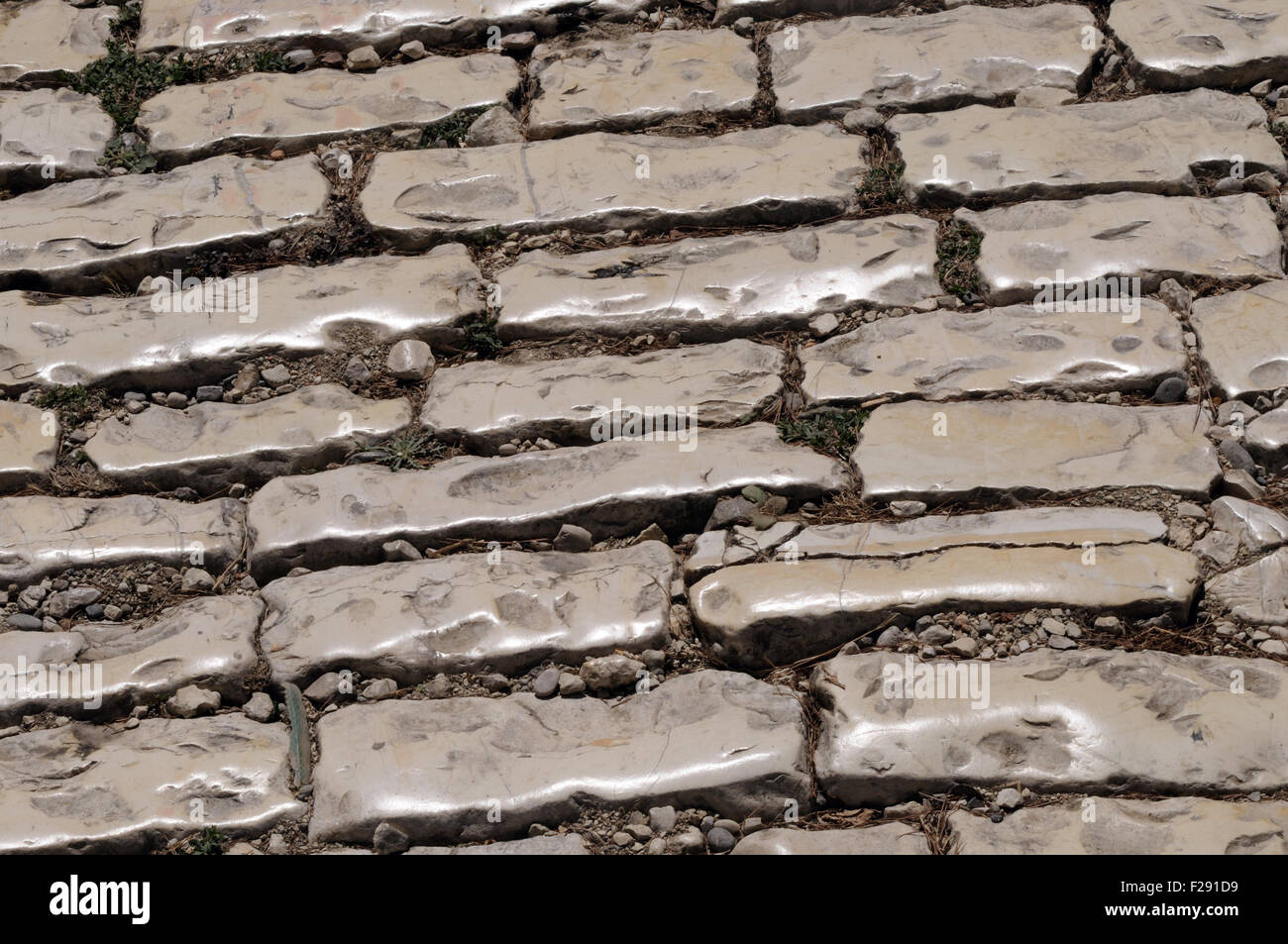 Limestone cobbles, polished by use, surface Rruga Mihal Komnena, Rruga e Kalase, Castle street, rthe road to Berat Castle. Stock Photo