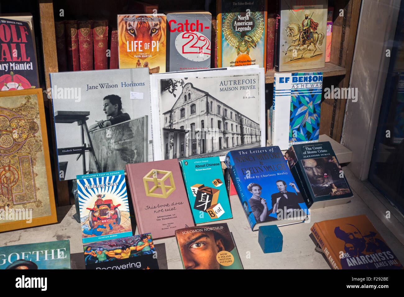 A display of books for sale in the window of a secondhand bookshop, Edinburgh, Scotland. Stock Photo