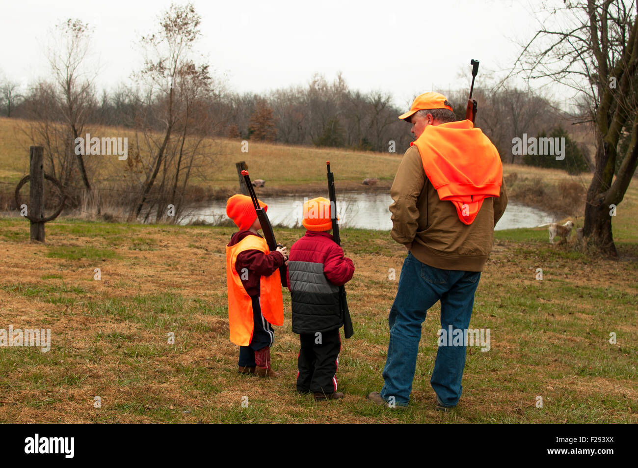 Man teaching boys practice hunt Stock Photo