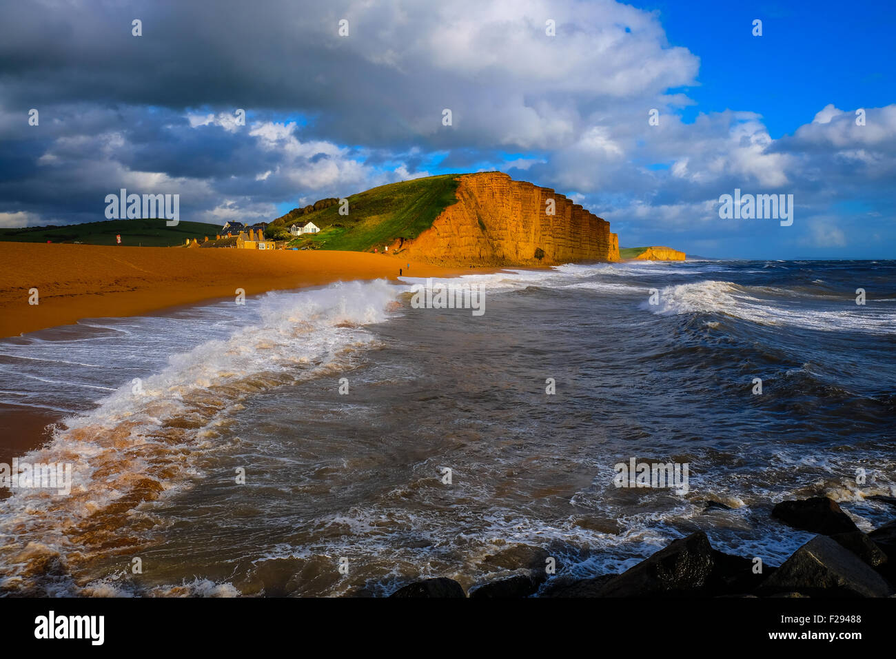 West Bay, Dorset, UK. 14 September 2015. Strong winds gusting at up to 55 mph and heavy rain showers batter the South West Coast at West Bay on Dorset's Jurassic coast as the Met Office issues a yellow weather warning. Credit:  Tom Corban/Alamy Live News Stock Photo