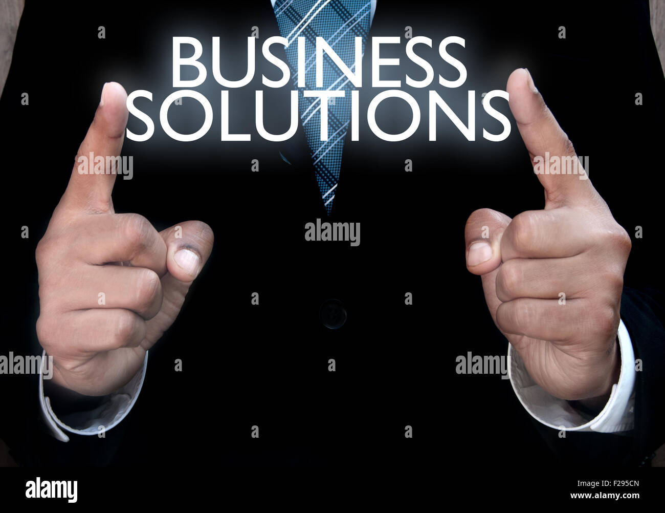 Business man holding solutions in his hands Stock Photo Alamy