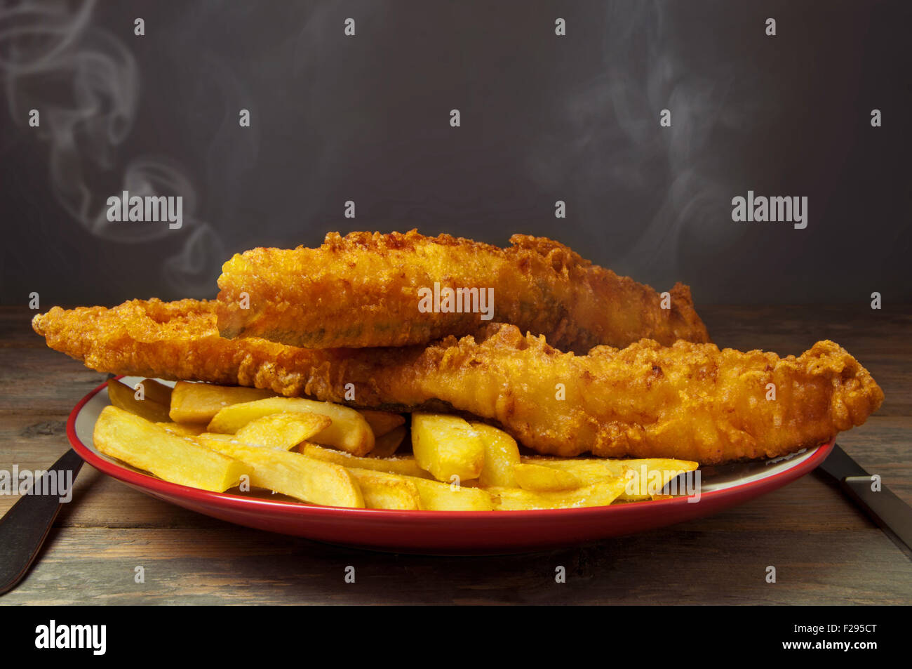 Hot plate of traditional fish and chips Stock Photo
