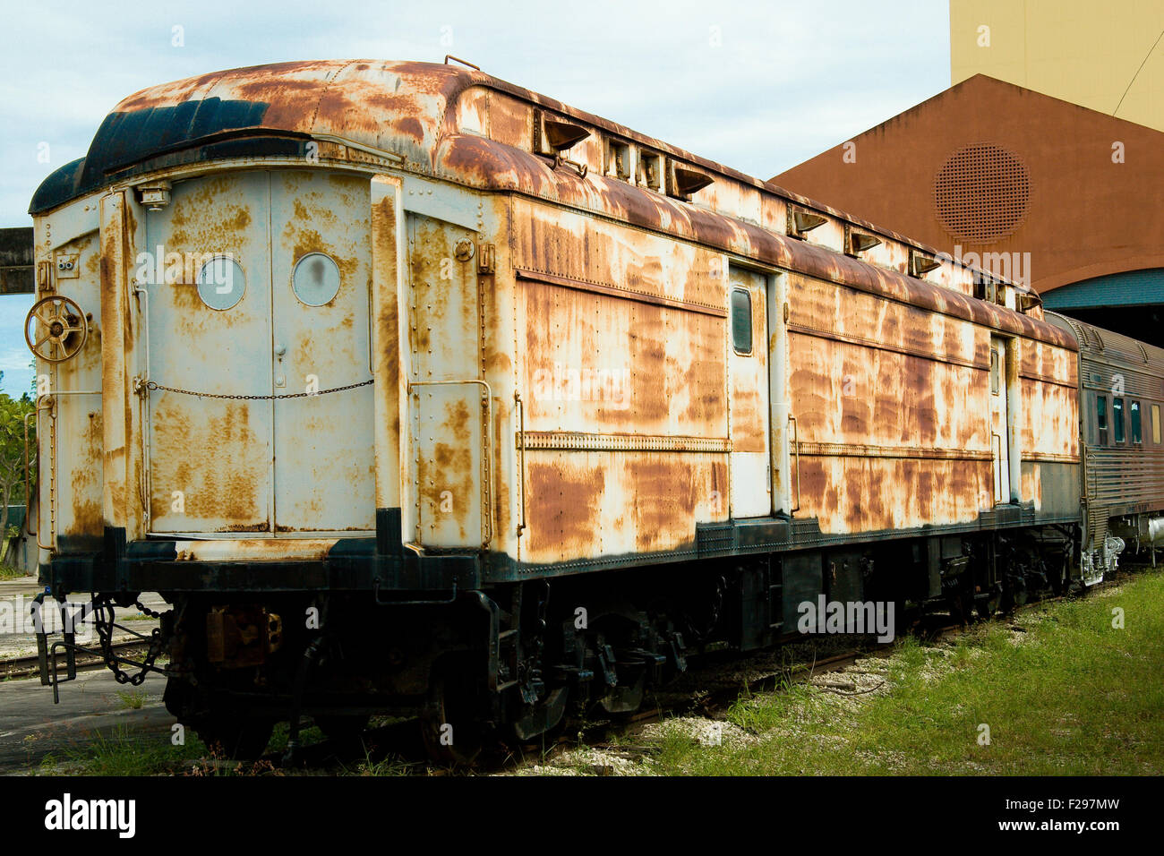 An old rusty train car on a train yard. Stock Photo