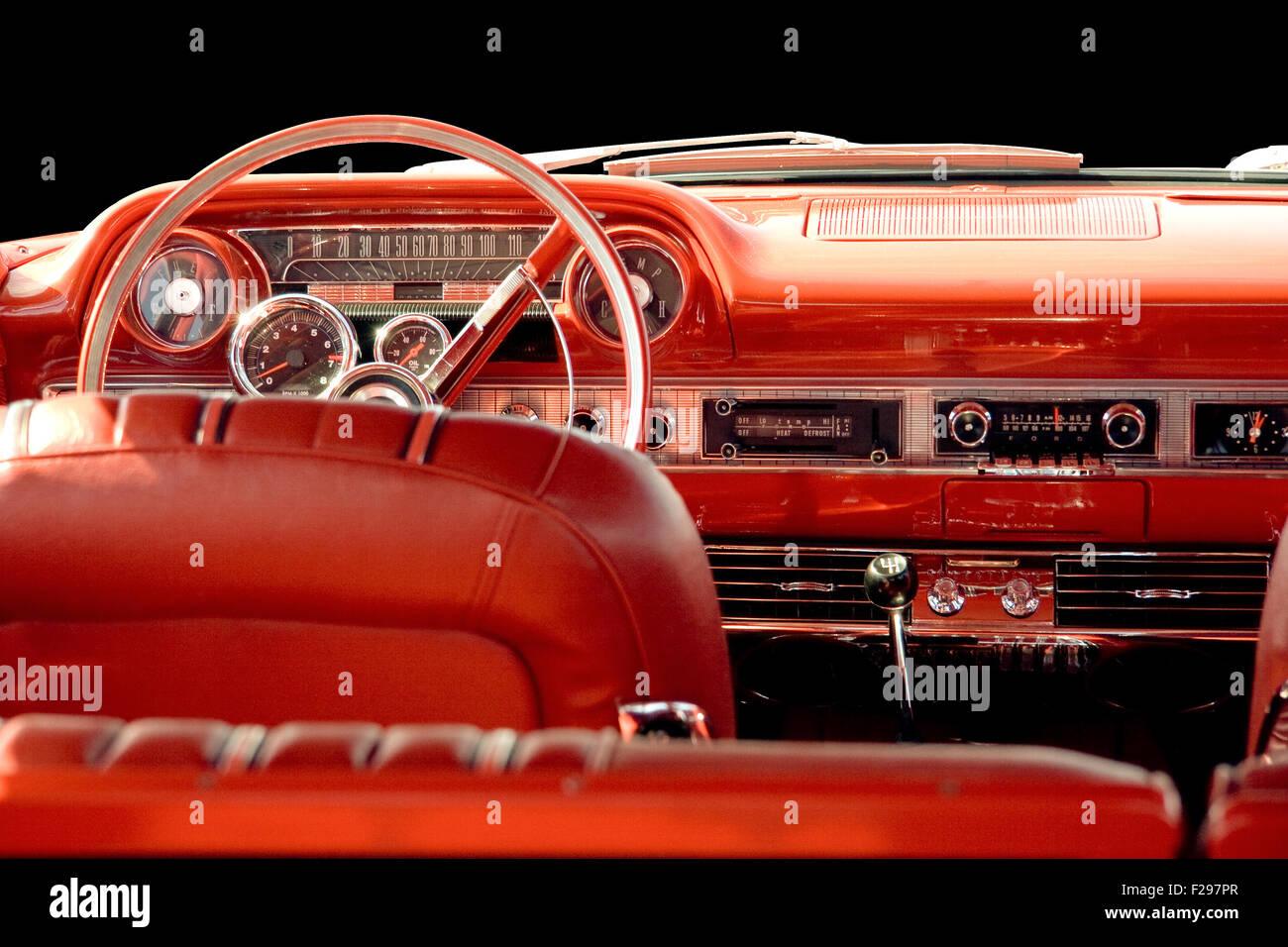 Interior of classic or vintage car with red leather interior and