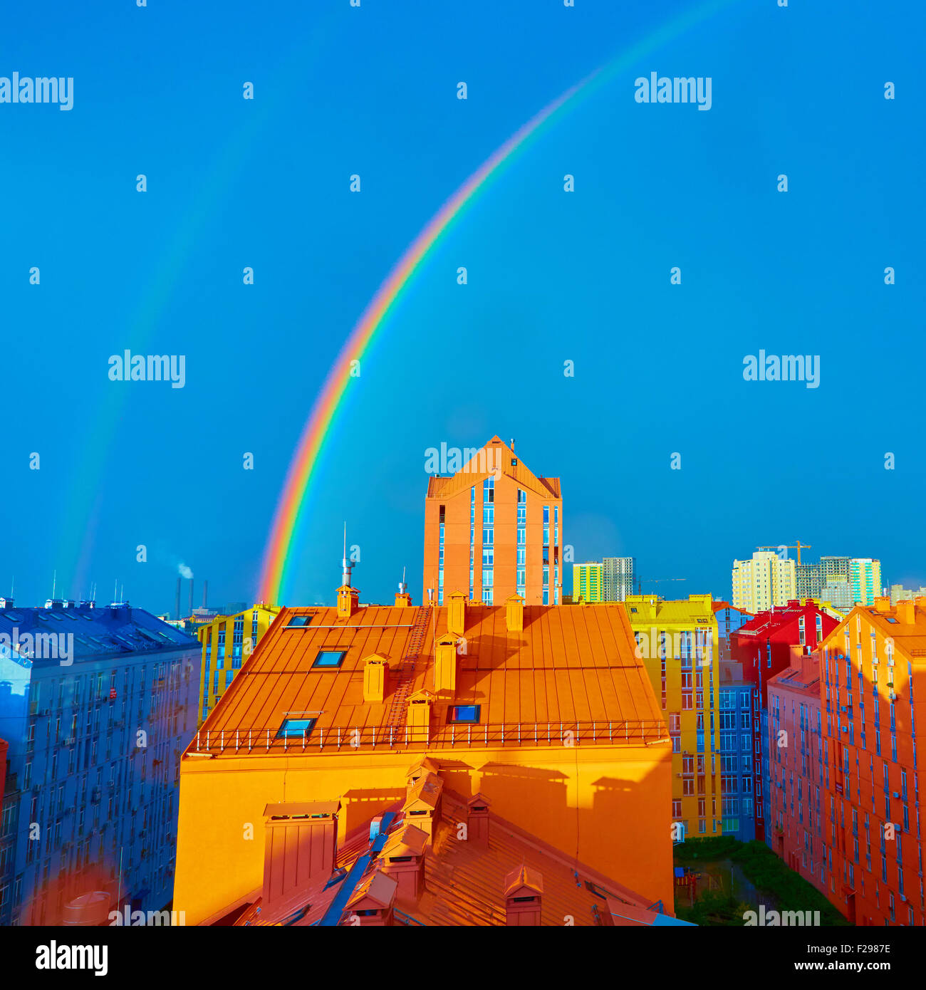 Double rainbow over the city Stock Photo - Alamy