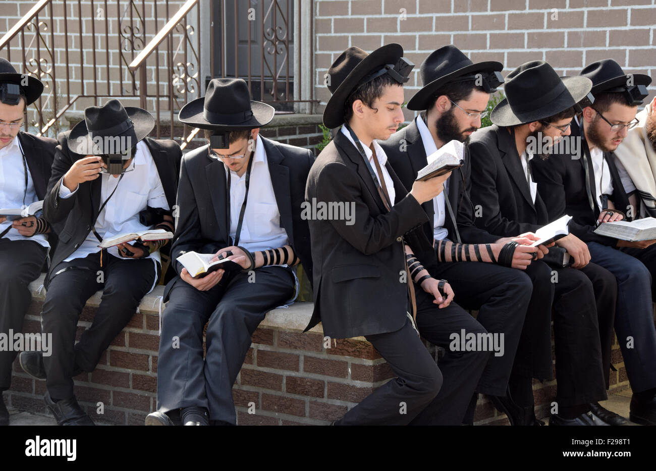 On the day before Jewish New Years religious boys pray outdoors at the