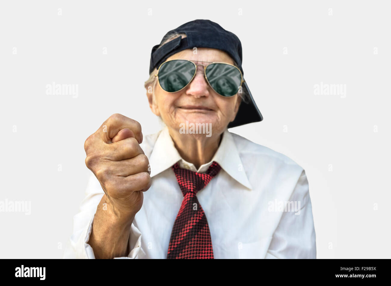 Elderly woman showing fig sign. Selective focus on hand Stock Photo