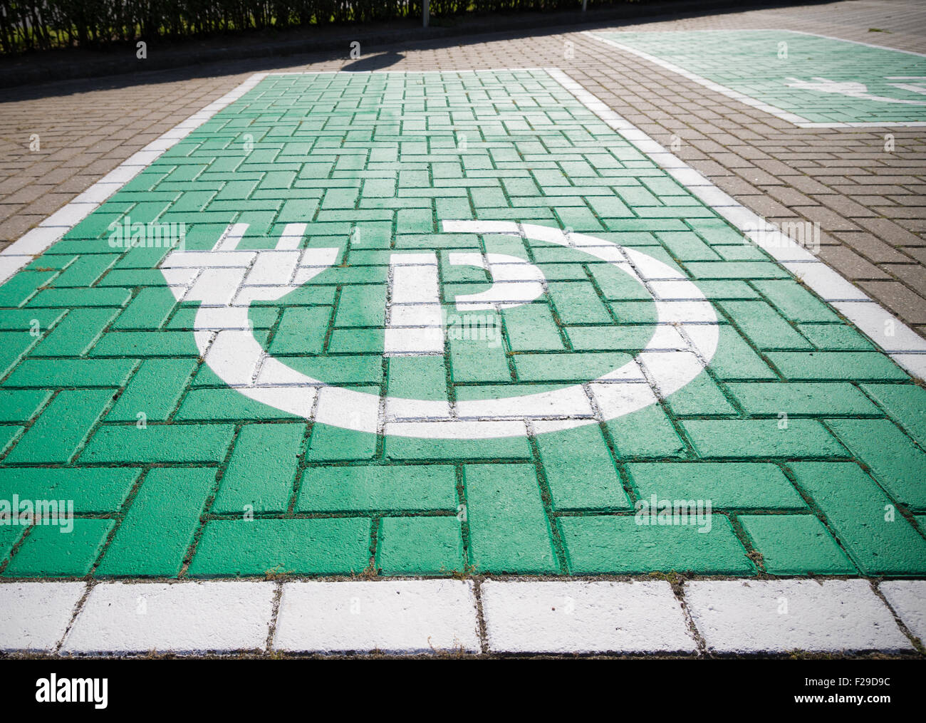 parking place with charging symbol for electric cars Stock Photo