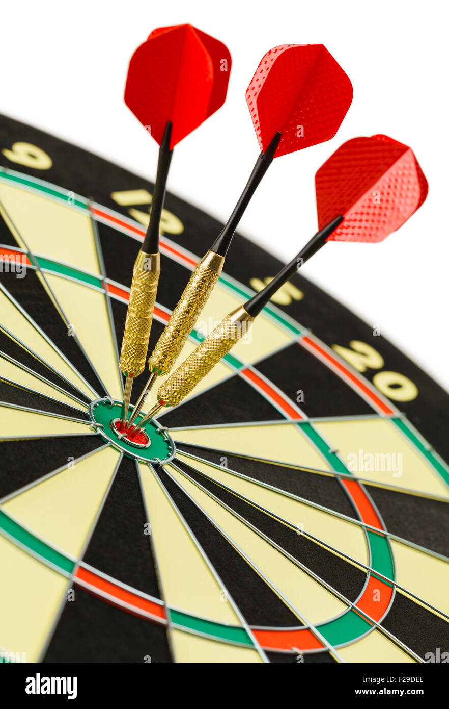 Three Darts in the Bulls Eye on Dart Board Isolated on White Background. Stock Photo