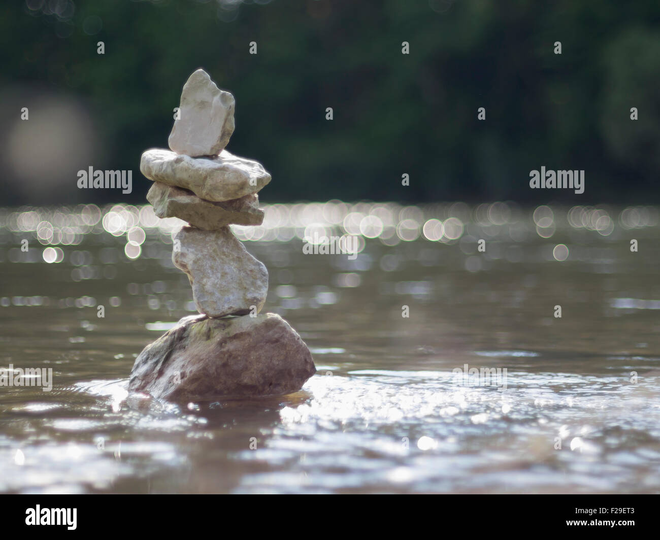 Close-up of stack of rocks balancing in Isar river, Bavaria, Germany ...