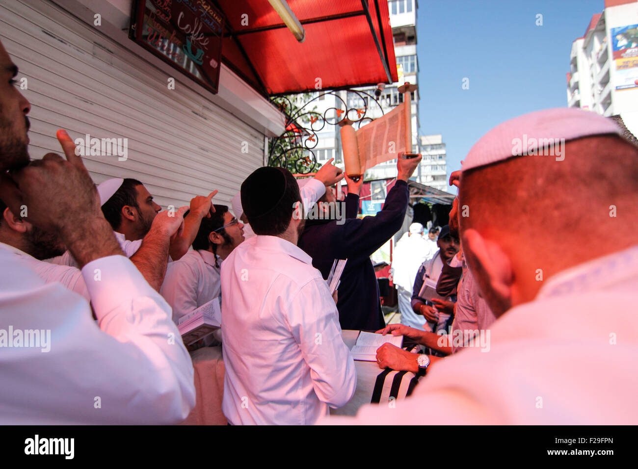 Uman, Ukraine. 13th Sep, 2015. Orthodox Jewish pilgrims hold 'Torah' during during the celebration of Rosh Hashanah in Uman. Every year, thousands of Orthodox Bratslav Hasidic Jews from different countries gather in Uman to mark 'Rosh Hashanah', a Jewish New Year near the tomb of Rabbi Nachman, the great grandson of the founder of Hasidism. © Nazar Furyk/Pacific Press/Alamy Live News Stock Photo