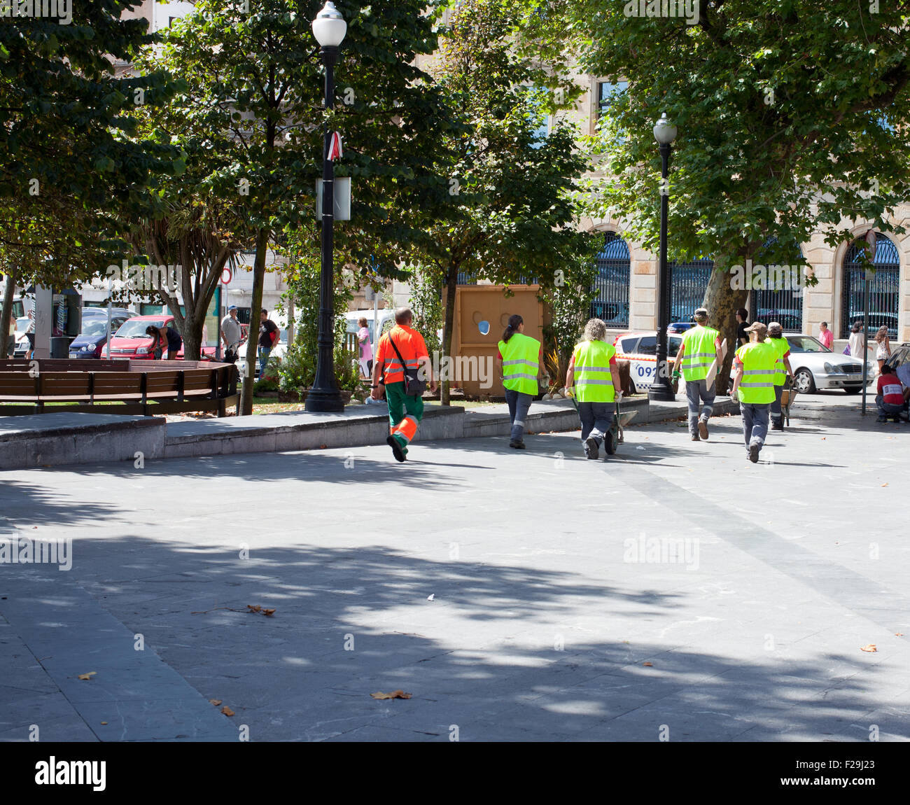 Garbage men in Gjion, Spain Stock Photo Alamy
