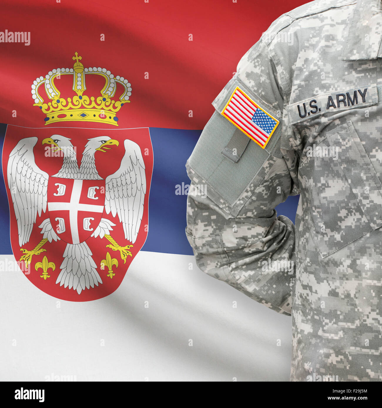 American soldier with flag on background series - Serbia Stock Photo