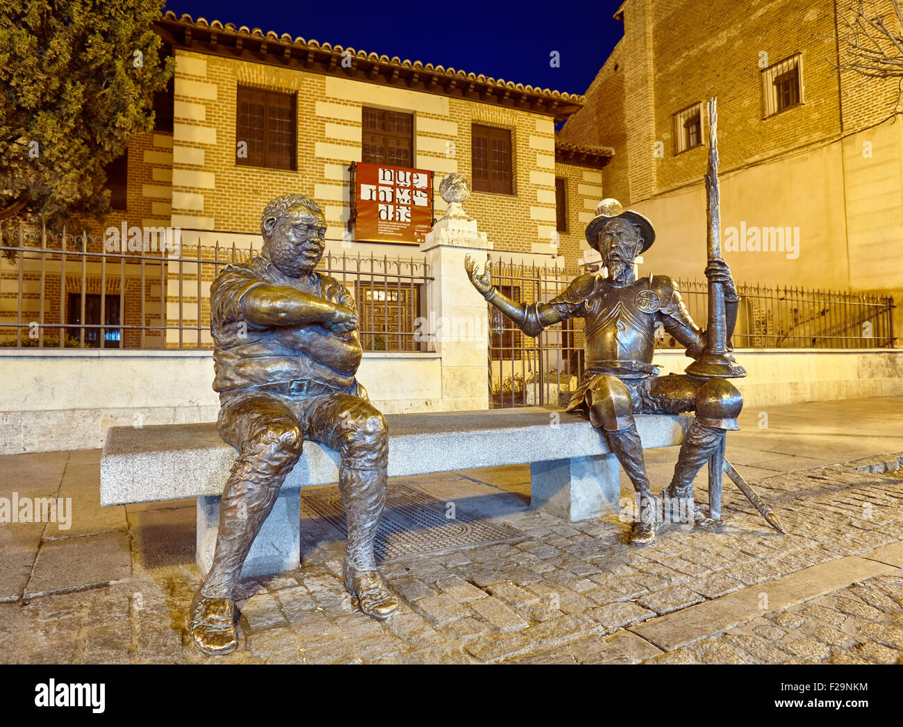 Don Quixote and Sancho Panza sculpture at the entrance to Cervantes Birthplace Museum, Alcala de Henares. Calle Mayor street, Al Stock Photo