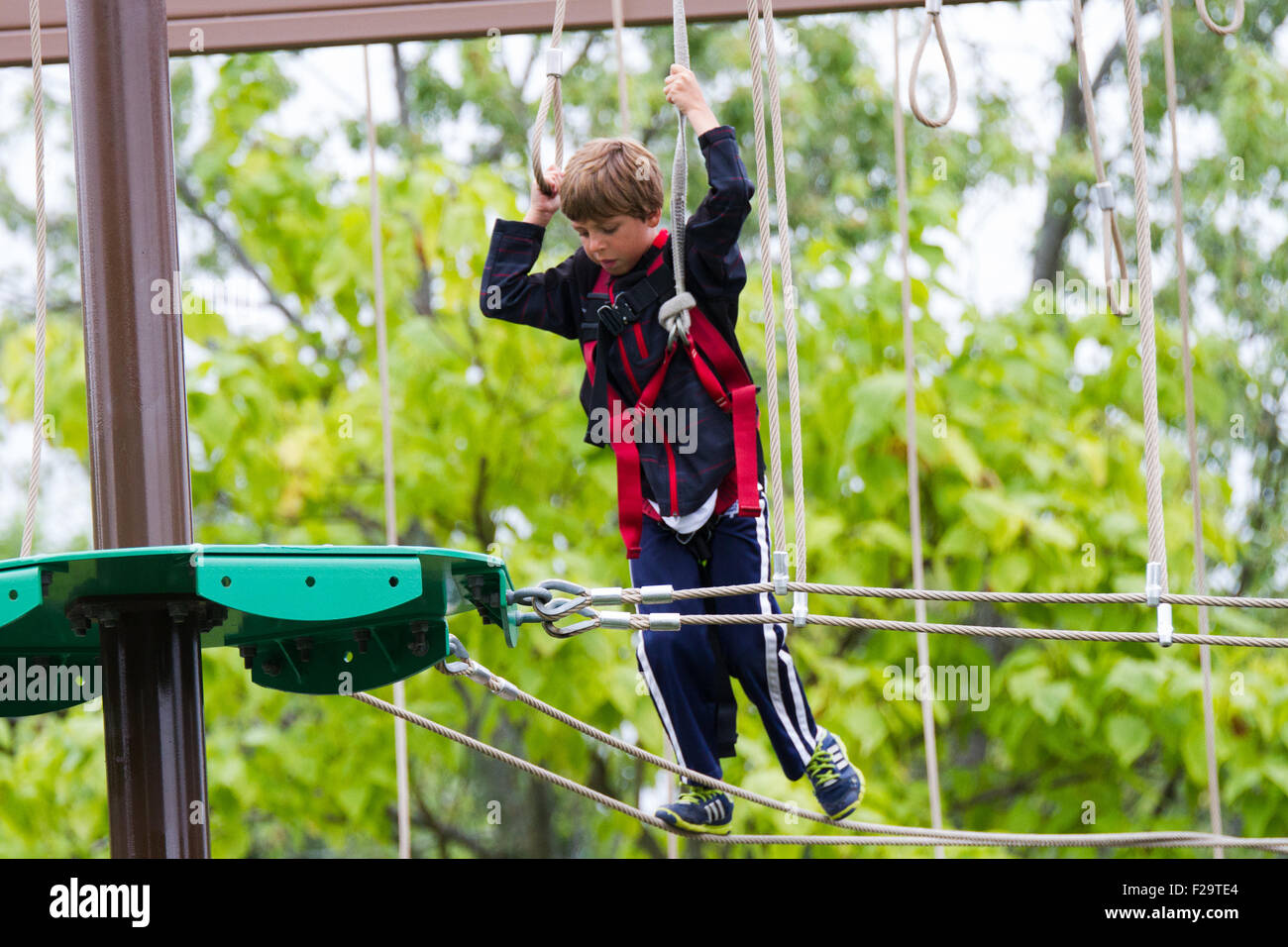 young boy walking rope outdoor nature activity Stock Photo Alamy