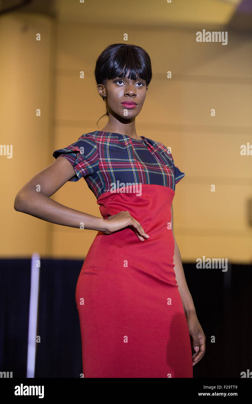 black woman arm waist red business dress Stock Photo