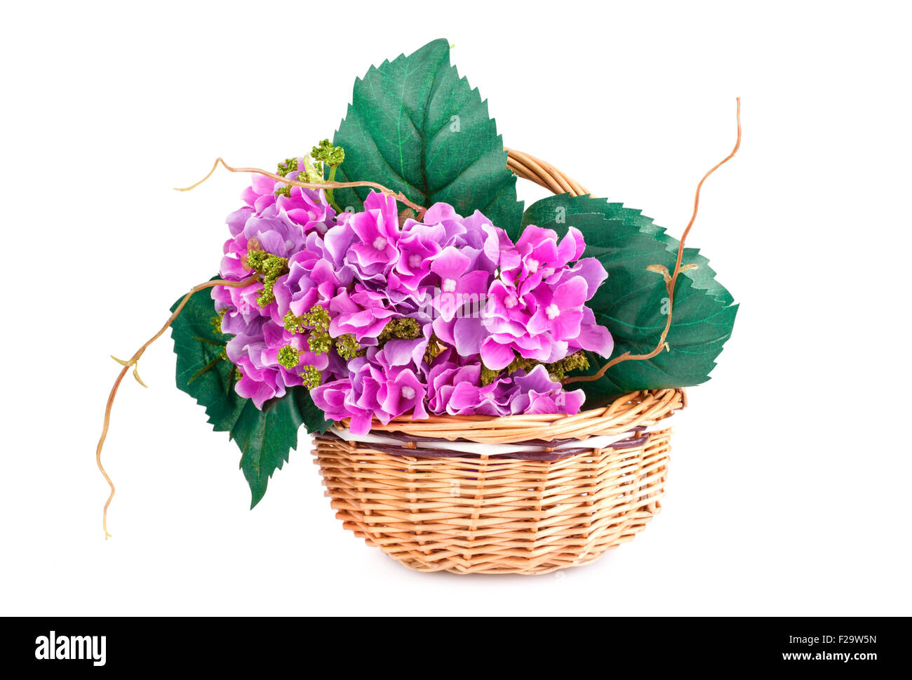 Pink fabric flowers in wicker basket isolated on white background Stock ...