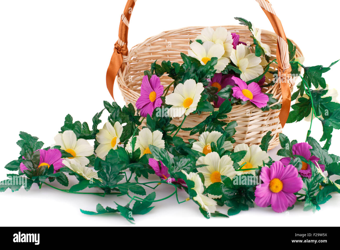 Fabric flowers in wicker basket isolated on white background Stock ...