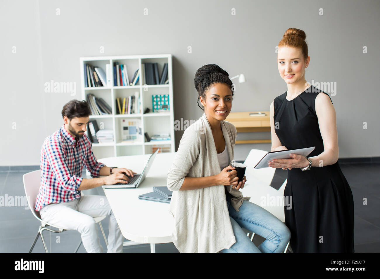 Young people in the office Stock Photo - Alamy