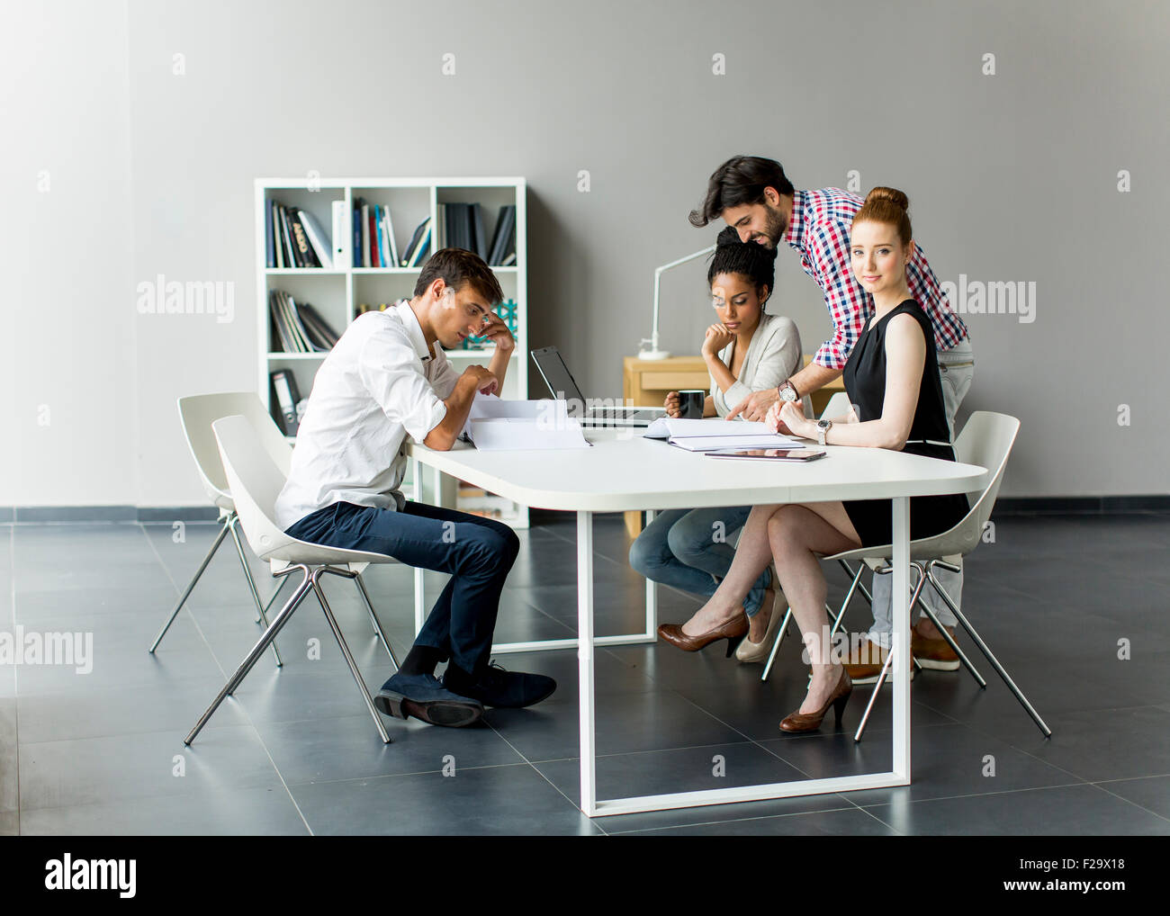Young people in the office Stock Photo - Alamy