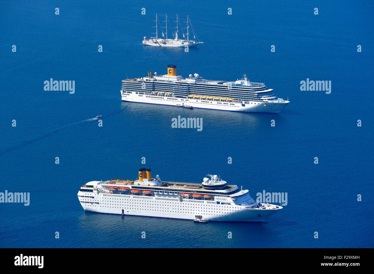 Cruise ships Costa classica in the foreground and Costa deliziosa behind sitting in the Caldera Santorini Greece Stock Photo