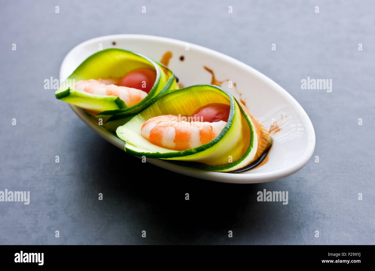Appetizer with zucchini, shrimp and tomatoes Stock Photo