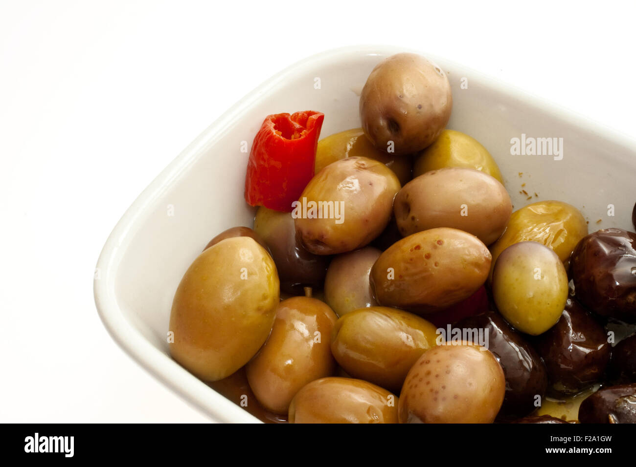 Olives inside a saucer on white background Stock Photo Alamy