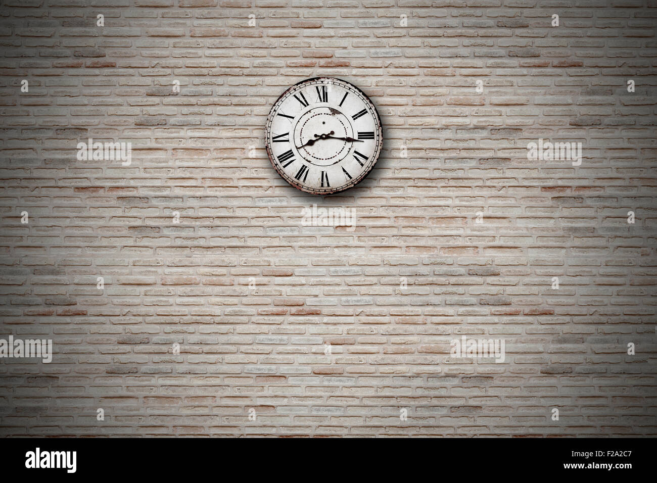 old clock on a brick wall Stock Photo Alamy