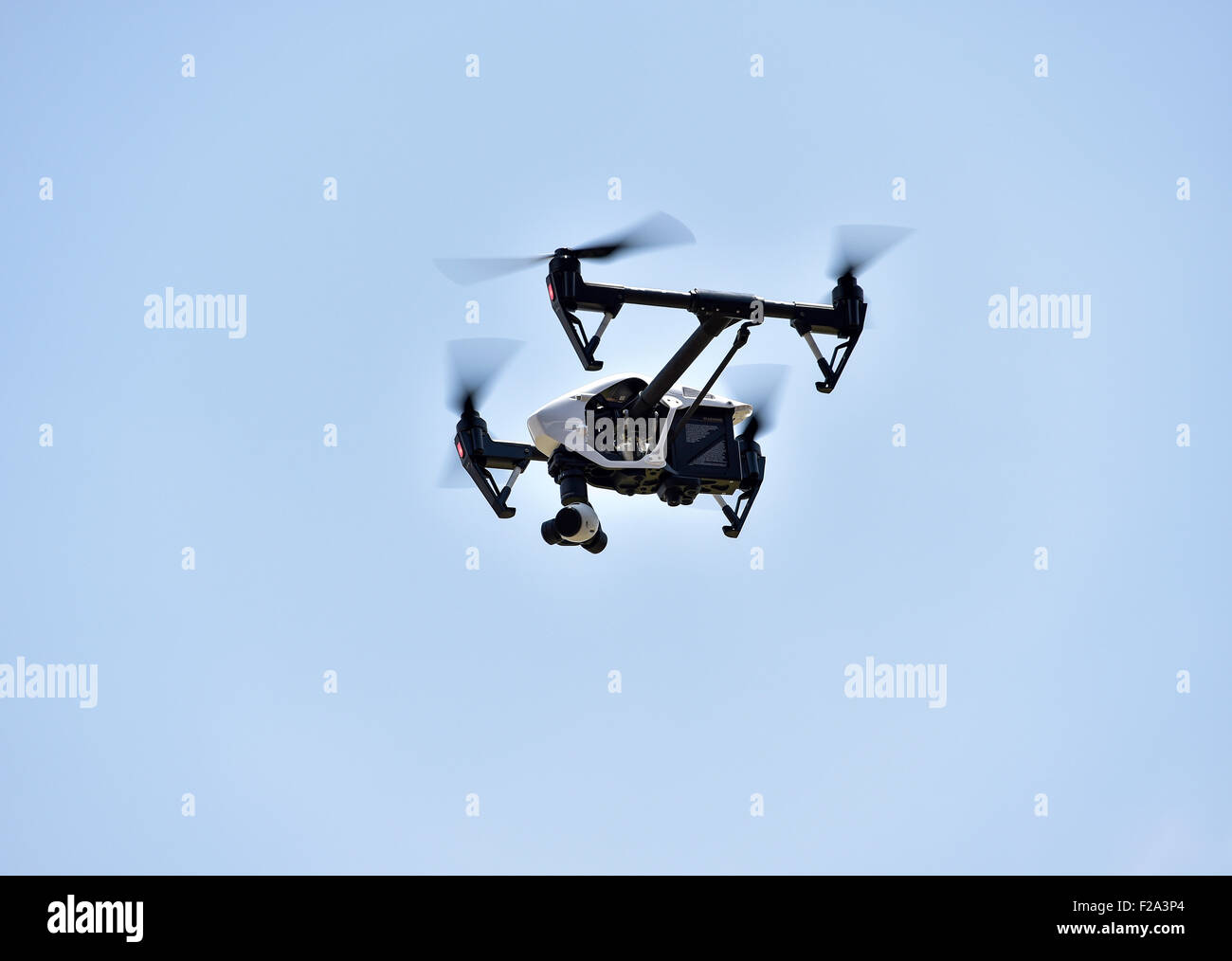Drone in flight, carrying a film camera Stock Photo Alamy