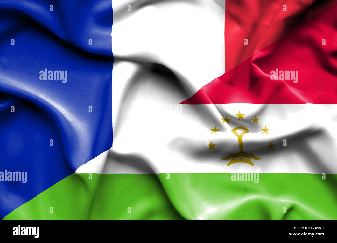 Waving flag of Tajikistan and France Stock Photo