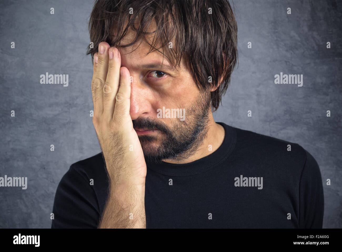 Portrait of tired exhausted man in trouble, problems in life Stock Photo