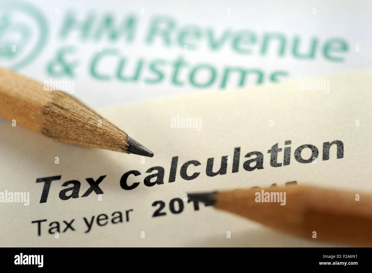 HMRC TAX CALCULATION LETTER WITH PENCILS RE INCOME SELF ASSESSMENT EMPLOYMENT AVOIDANCE HM REVENUE CUSTOMS TAXES FORM OWED UK Stock Photo