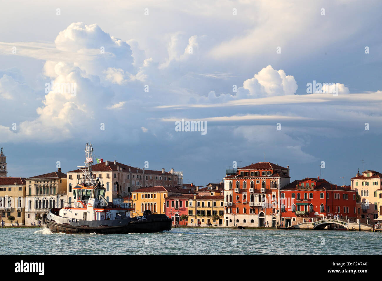 Cloud formations at Fondamenta delle Zattere waterfront.  Tug 'Giulia C',  IMO 9364514 Stock Photo