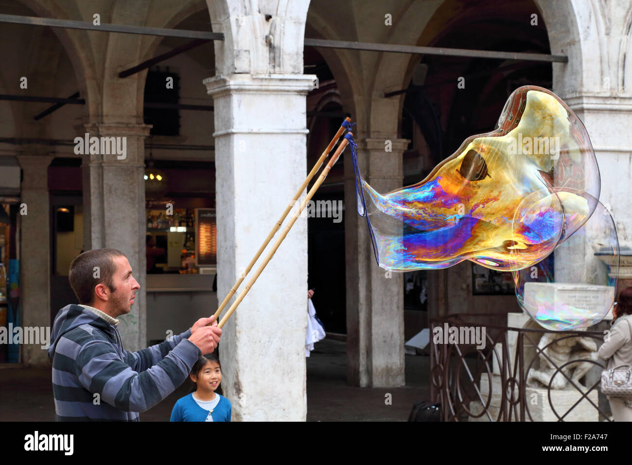 Soap bubble street artist performance in Venice Stock Photo