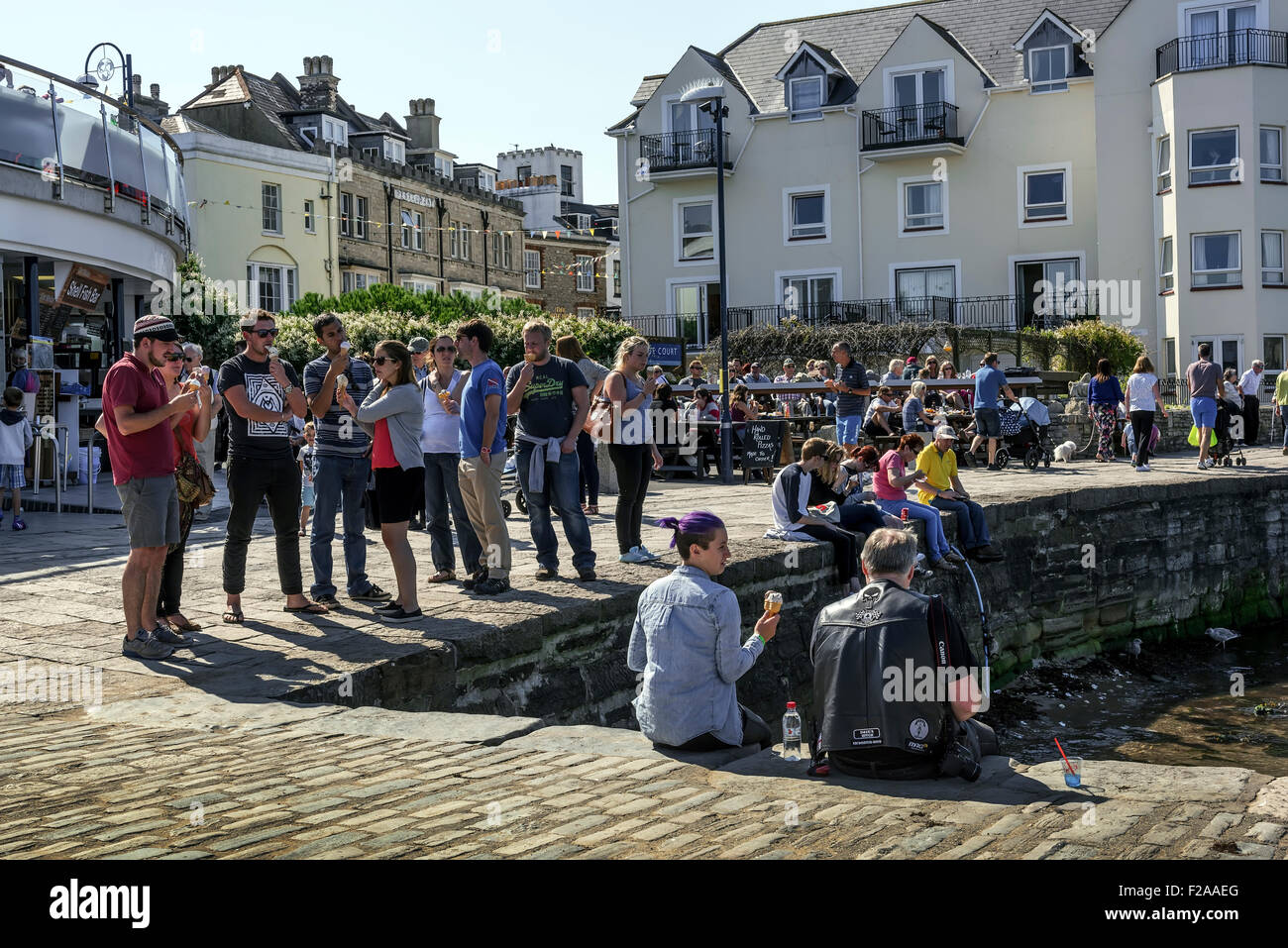 Ice cream eaters at Swanage. Stock Photo