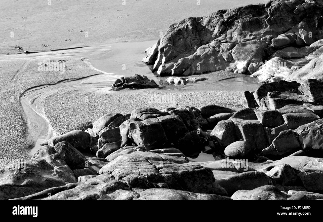 rocks and stones on a sandy beach Stock Photo