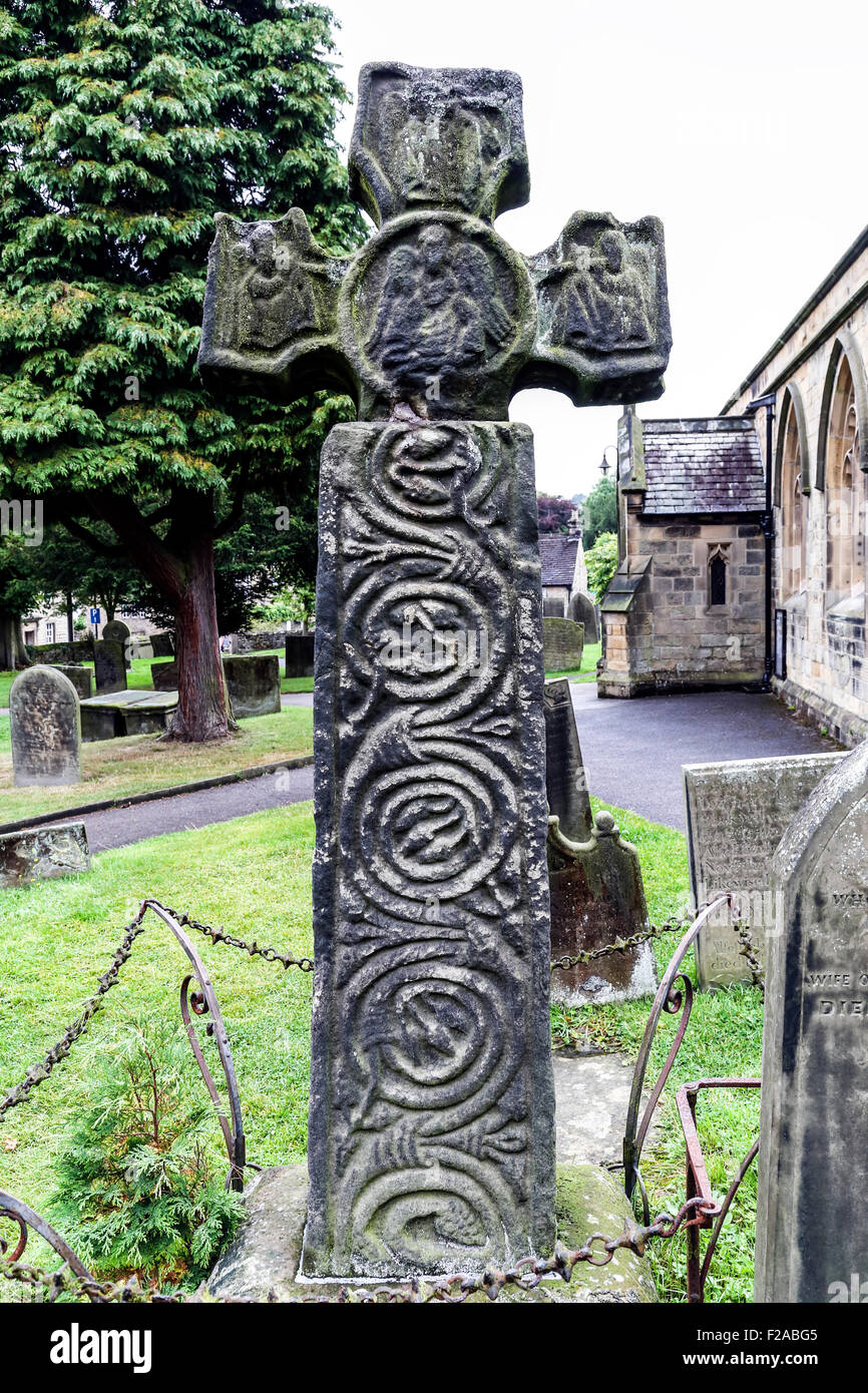 Celtic Cross 8th Century AD in Eyam parish church, Derbyshire Dales Peaks District, England- Stock Photo