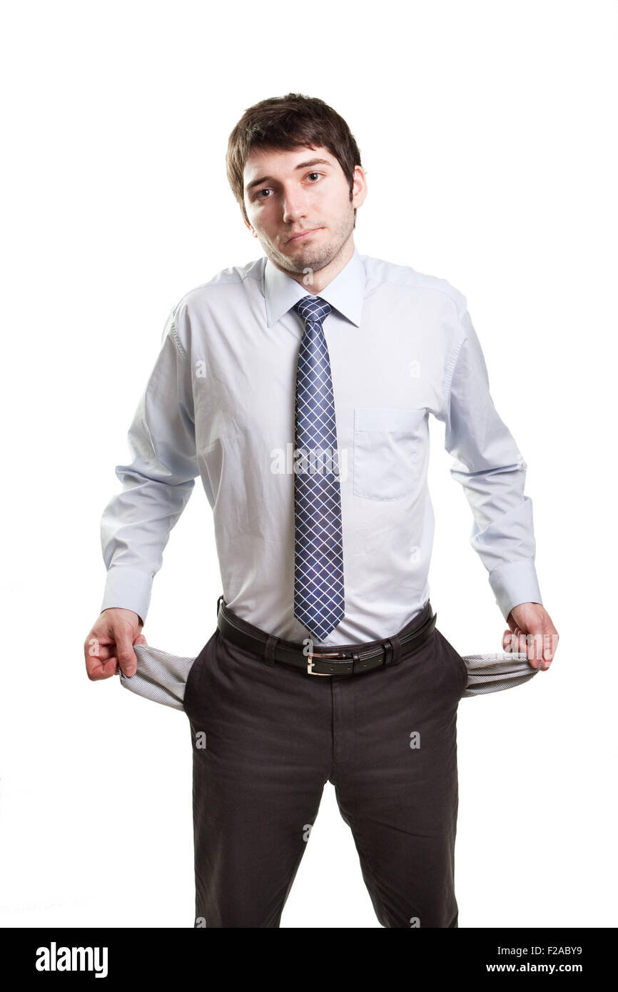 Sad and broke business man with empty pockets Stock Photo
