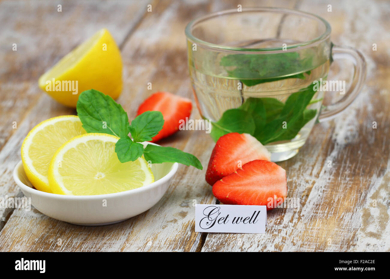 Get well card with mint tea, lemon and strawberries Stock Photo