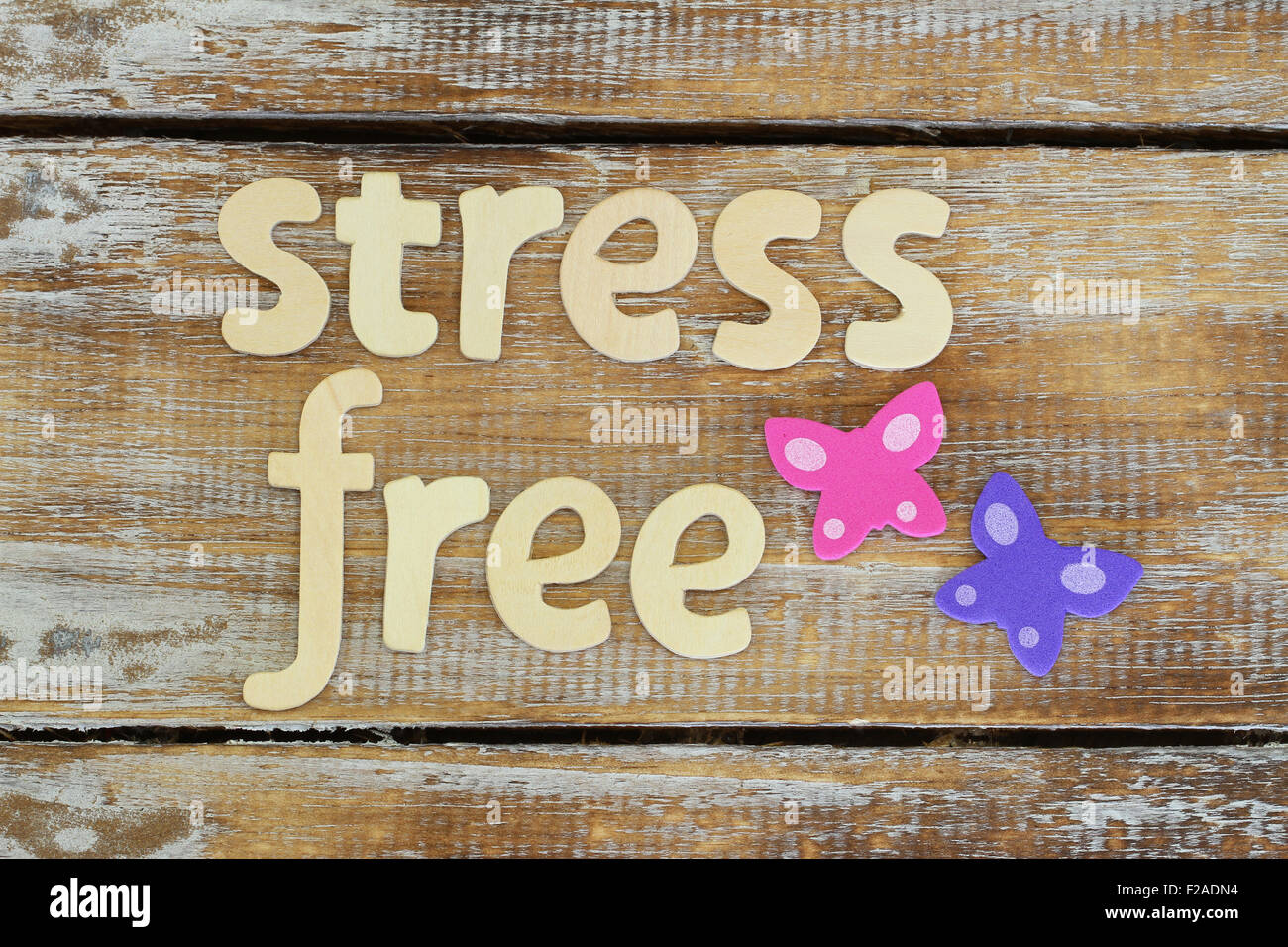 Stress free written with wooden letters on rustic surface Stock Photo