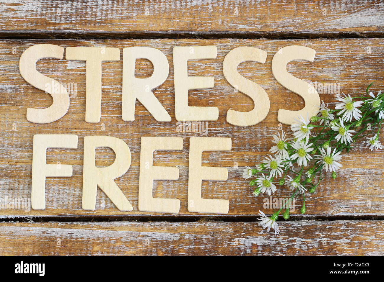 Stressful Lettering Stress free written with wooden letters on rustic wooden surface with ...