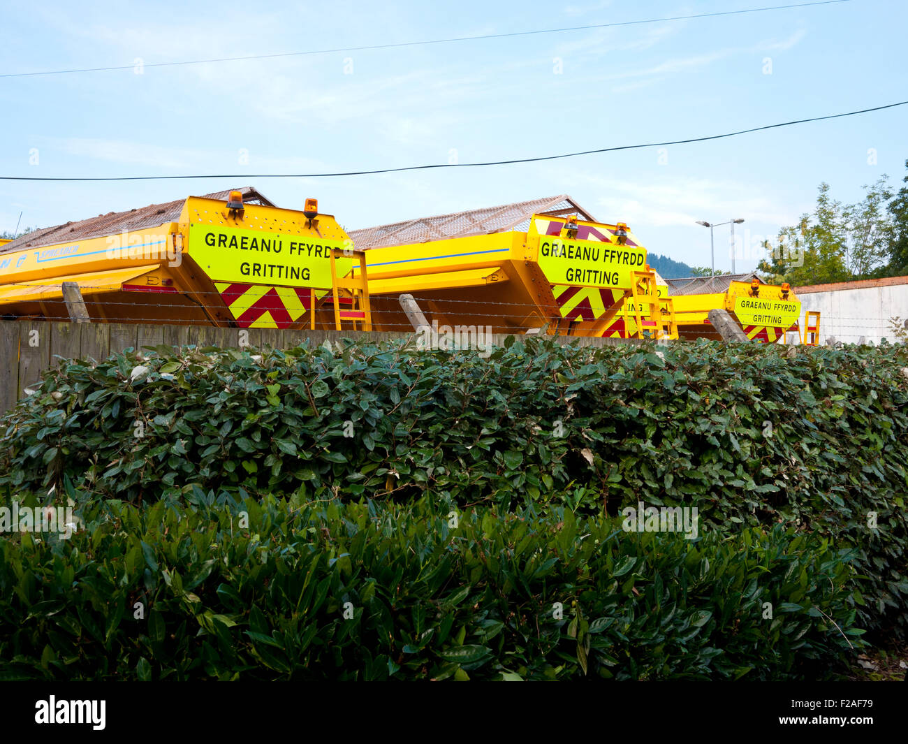 Salt Gritting Trucks in yard, Llanwrst,North Wales,UK. Stock Photo