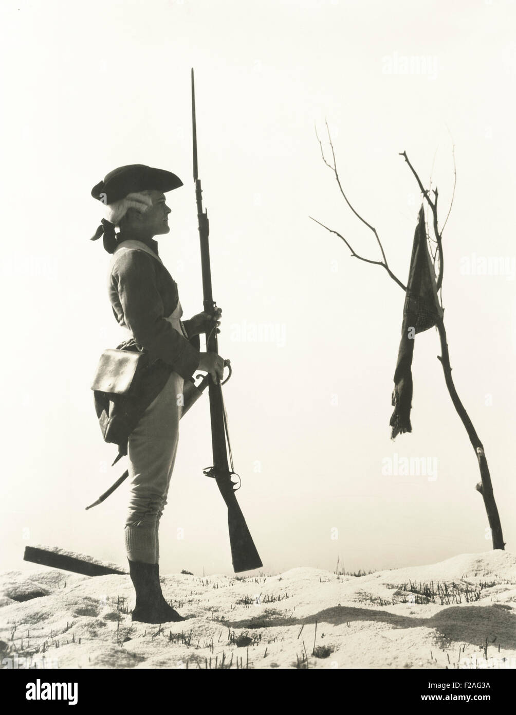 Portrait of 18th century soldier looking at flag (OLVI008 OU261 F) Stock Photo