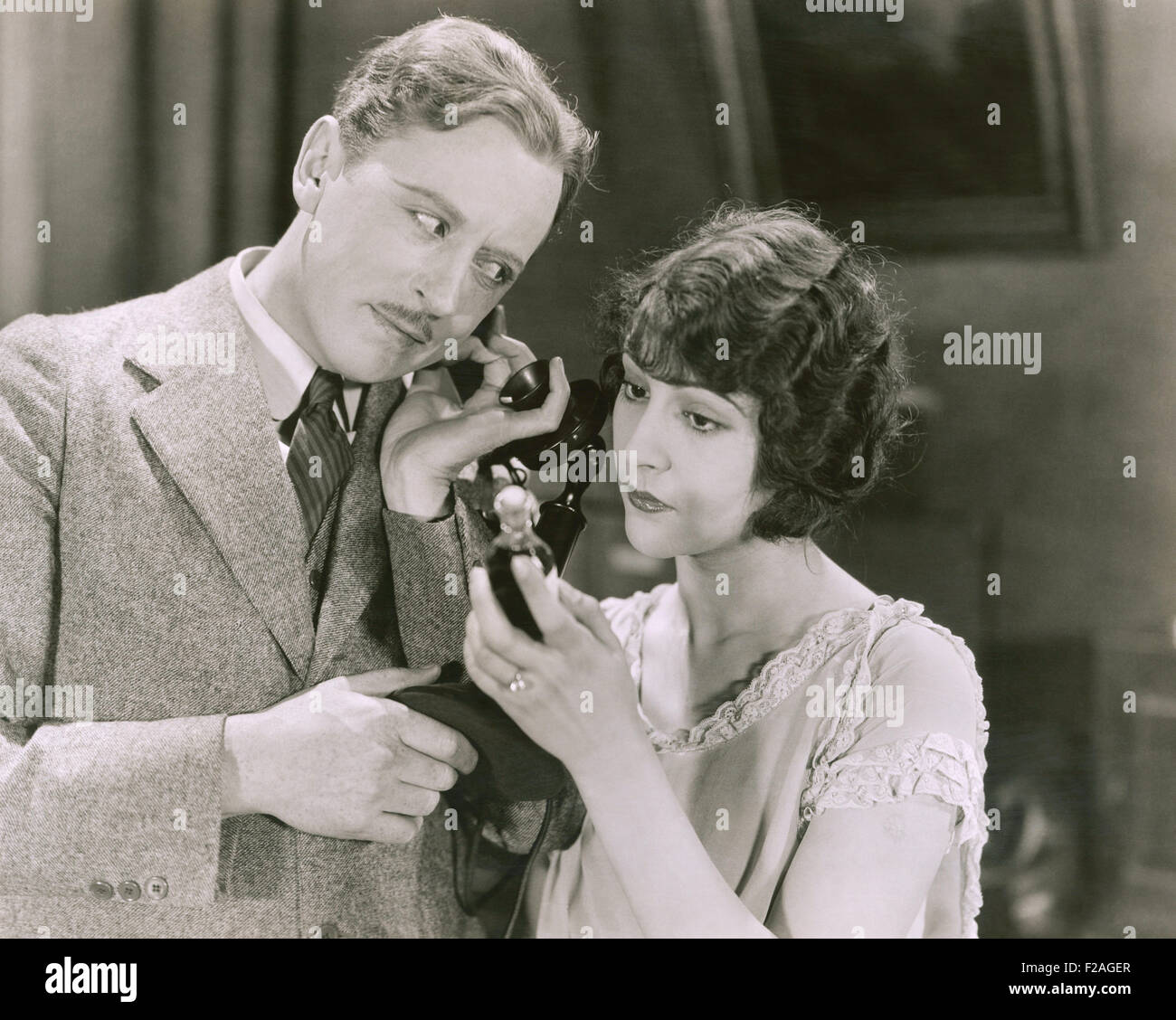 Listening in on  phone conversation (OLVI008 OU142 F) Stock Photo