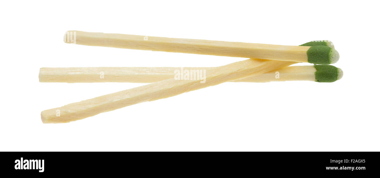 Three green tipped wood large kitchen matches isolated on a white background. Stock Photo