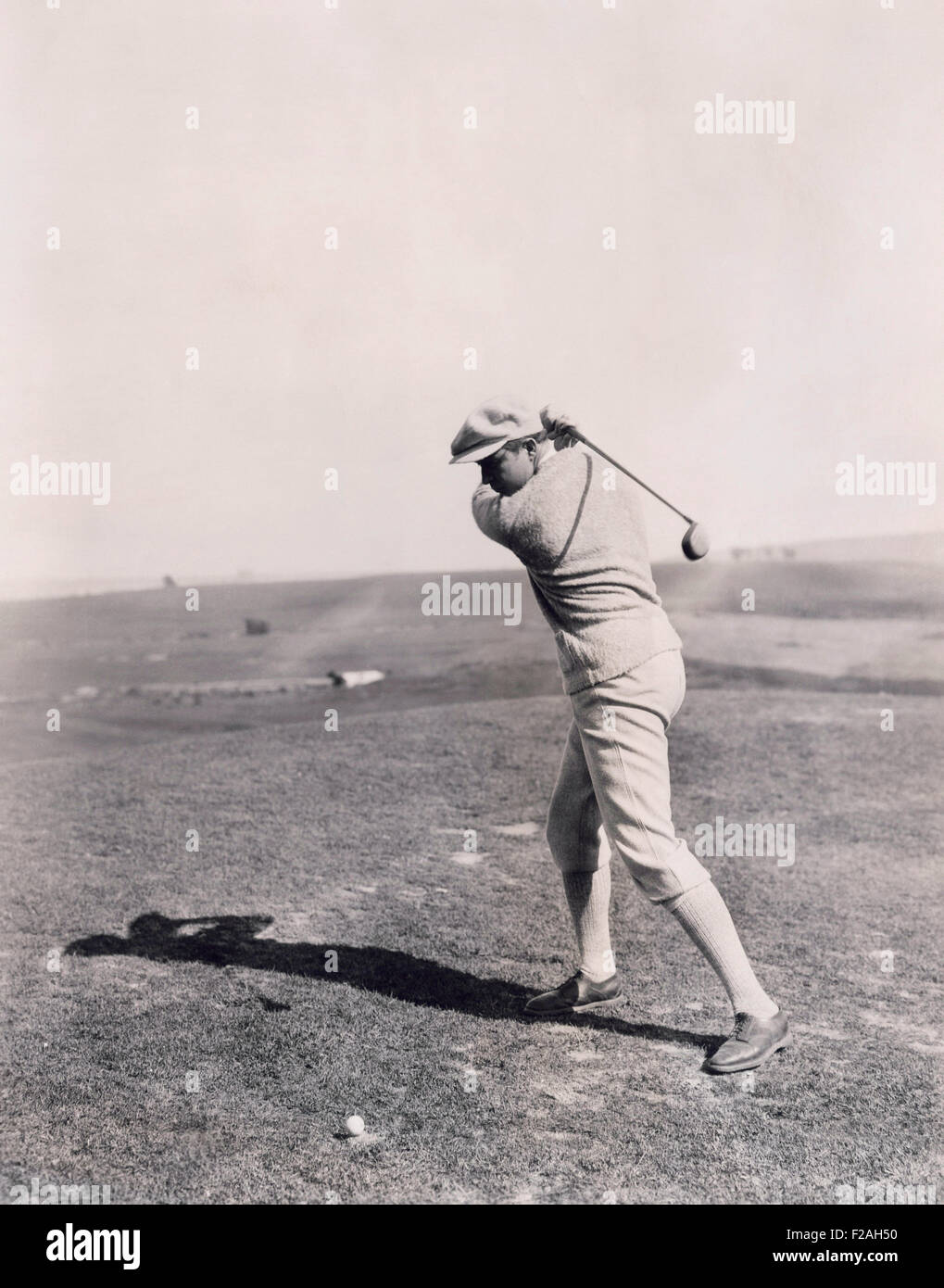 Taking a swing at it (OLVI008 OU011 F) Stock Photo